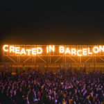 Made In Barcelona light up sign with fans in front